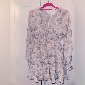 Long sleeve baby doll dress.